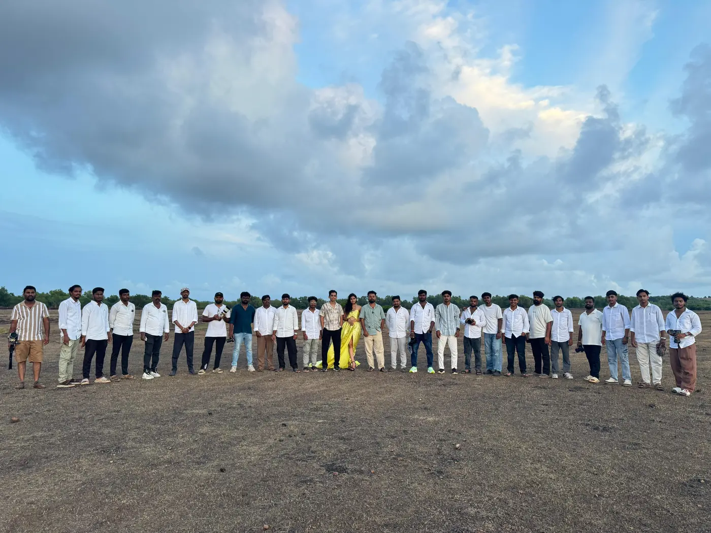 A full SVM Photography batch lined up on an open location at golden hour with the models they were shooting